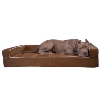 A large dog lying on the Bully Beds three-sided orthopedic bolster bed in chocolate